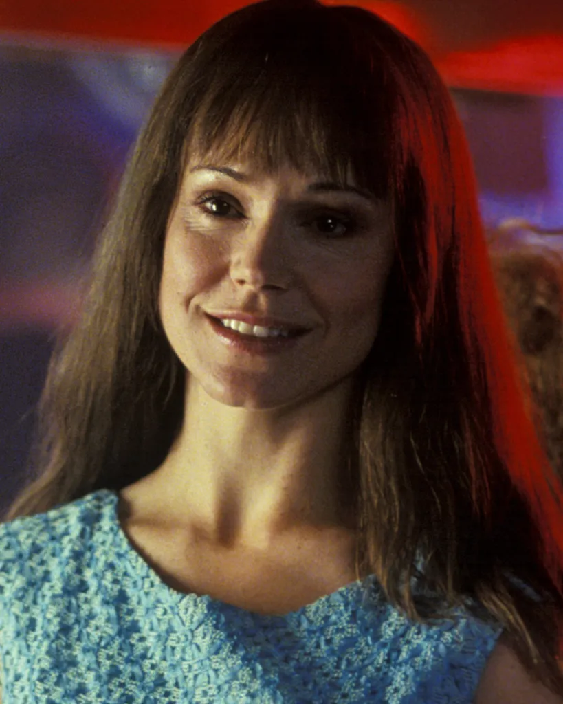 Frances O'Connor smiling, in a film still from Three Dollars, 2004