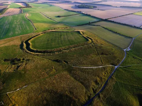 Aerial view of the oval ramparts of Uffington Castle hillfort on White Horse Hill